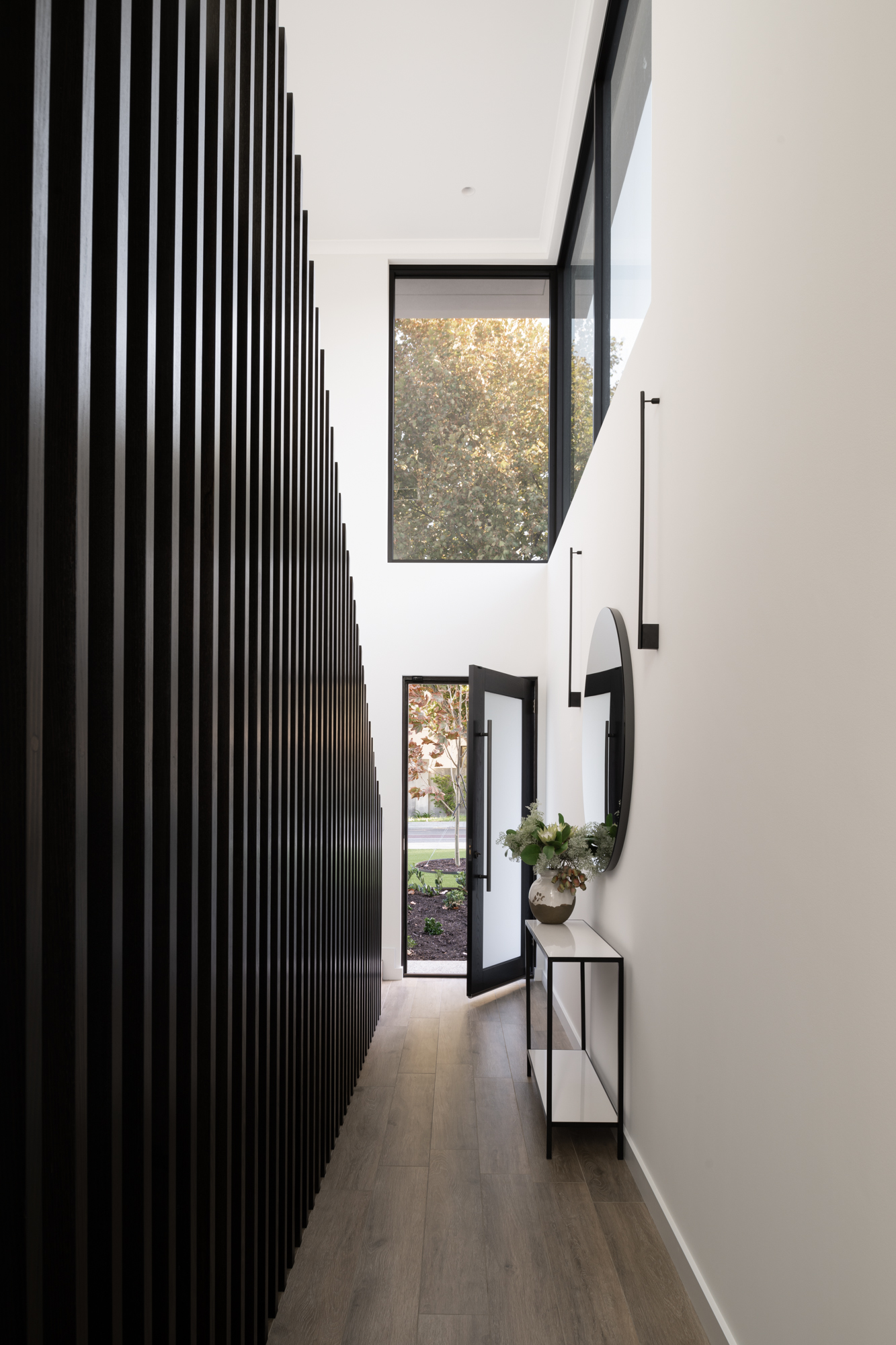 Striking edge to edge timber walling with offset levels and featured prominent windows