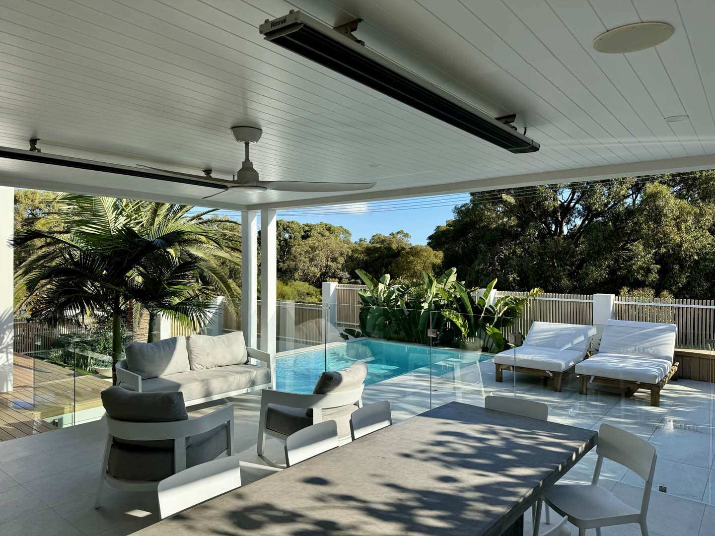 Stacking windows to back of sofa which on a pleasant day open into the backyard enabling indoor to outdoor conversations