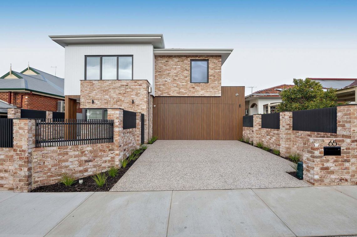 Two storey brick and weatherboard home with timber gate in North Perth
