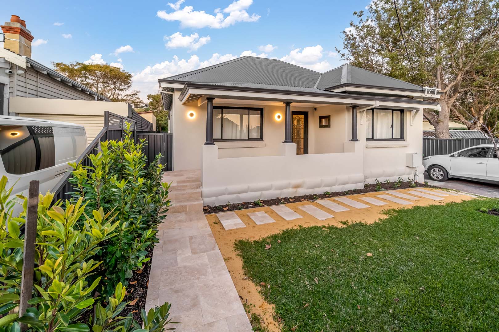 Character home front verandah at dusk with limestone path in Fremantle