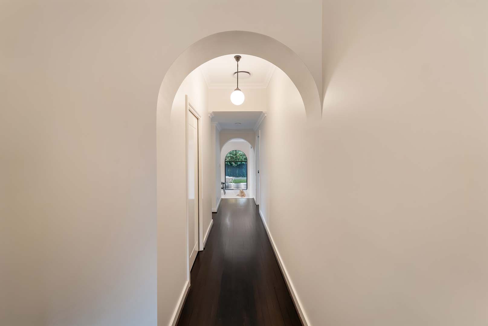 Arched hallway with dark timber floors in Fremantle