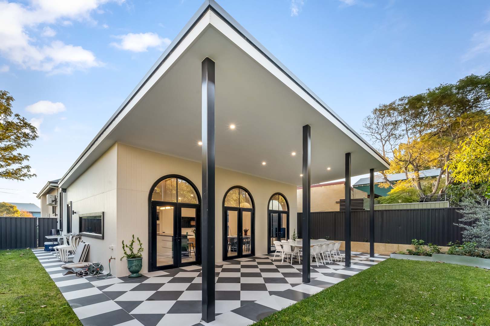 Rear alfresco with checkerboard tiles and arched French doors in Fremantle