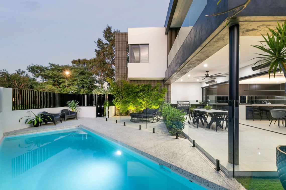 Pool and alfresco with dining setting at dusk in Attadale