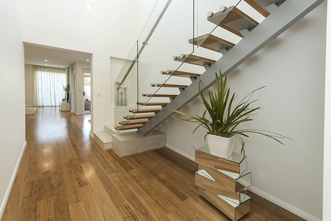 Floating timber staircase with glass balustrade in Ardross