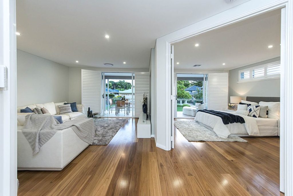 Living room and main bedroom opening to a balcony in Ardross