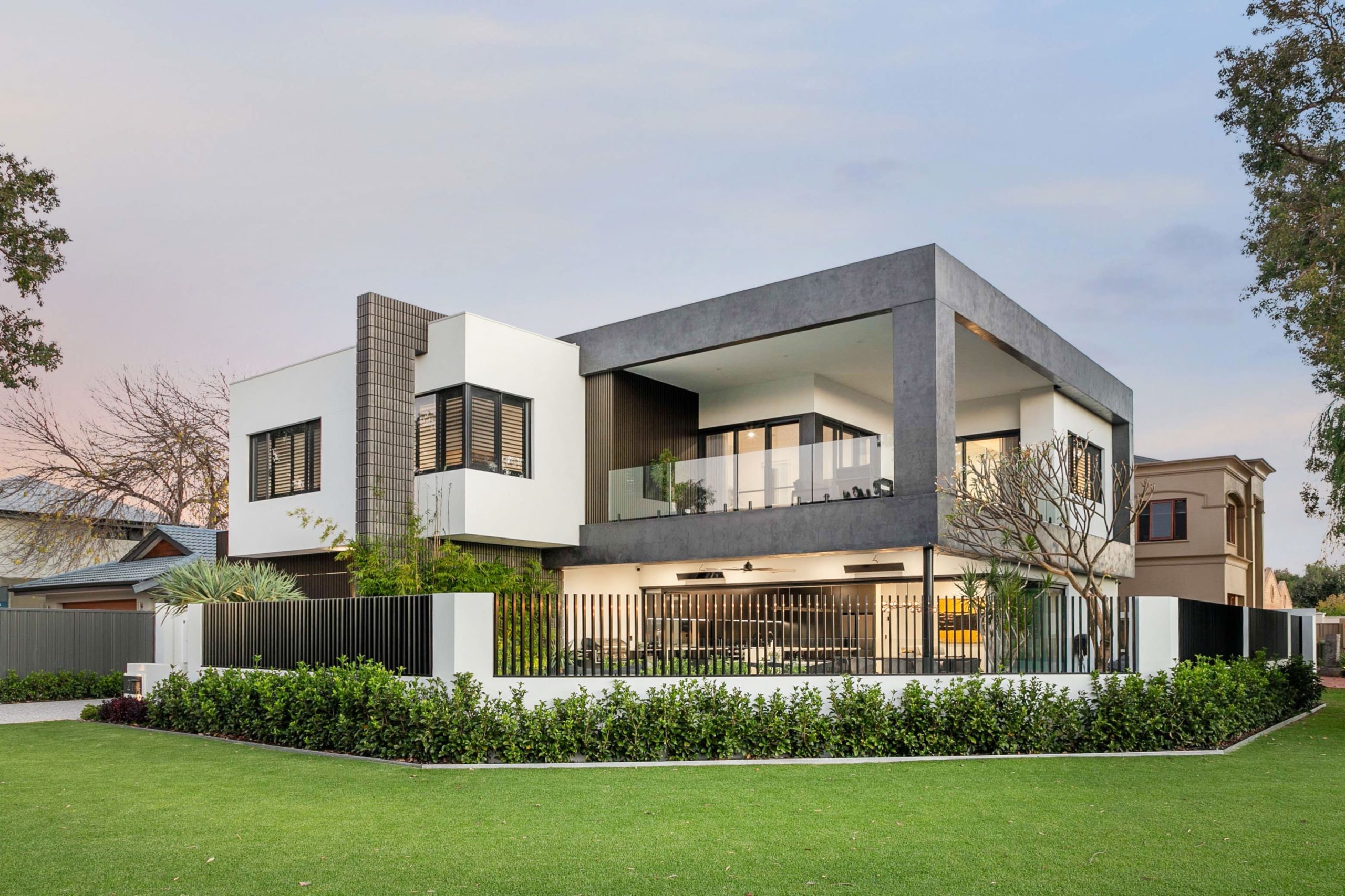 Street view of a modern two storey home with cantilevered balcony in Attadale
