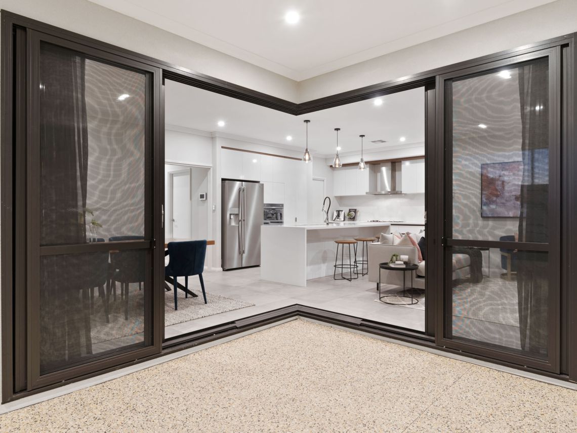 Corner stacking doors opening to the kitchen and living area in Tuart Hill
